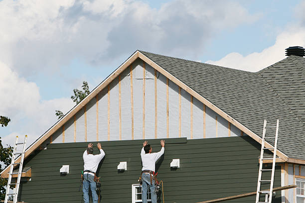 Professional Storm Damage Siding Repair technician working in Winchester, IL